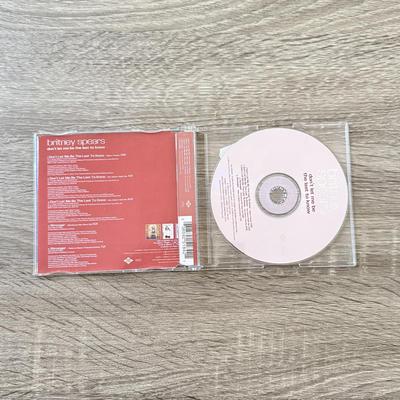 LOT 105A: Y2K Britney Spears Planet Hollywood Ladies' Shirt (Large) & Collection of CDs: Britney Spears' Boys, Don't...