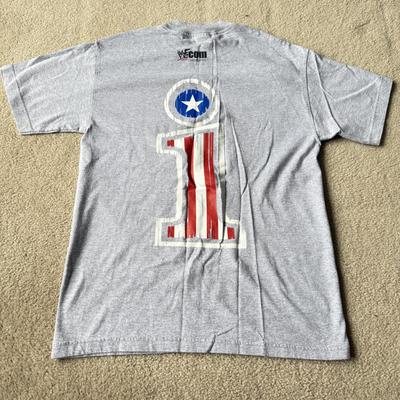 LOT 193B: 1999 WWF The Rock T-Shirt & 2000 WWF Kurt Angle T-Shirt (Medium)