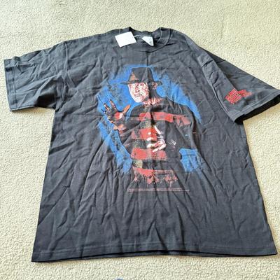 LOT 210A: 2000s Planet Hollywood Horror Series NWT T-Shirts (XL), Embroidered Universal Studios Islands of Adventure Orlando Polo NWT (L)...