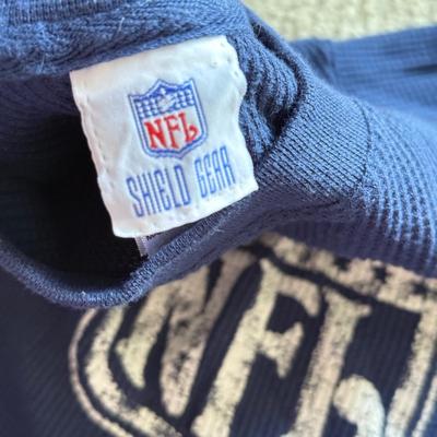 LOT 216A: NFL Team Merch: Green Bay Packers (Shirts, Jersey, Sweatpants), Miami Dolphins (Bedazzled Tee, Dan Marino Starter T, Jersey),...