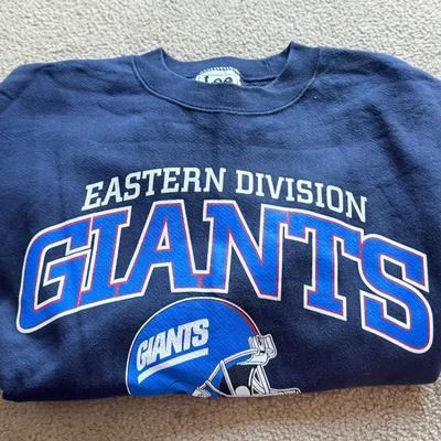 LOT 216A: NFL Team Merch: Green Bay Packers (Shirts, Jersey, Sweatpants), Miami Dolphins (Bedazzled Tee, Dan Marino Starter T, Jersey),...