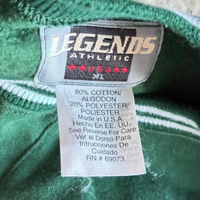 LOT 216A: NFL Team Merch: Green Bay Packers (Shirts, Jersey, Sweatpants), Miami Dolphins (Bedazzled Tee, Dan Marino Starter T, Jersey),...