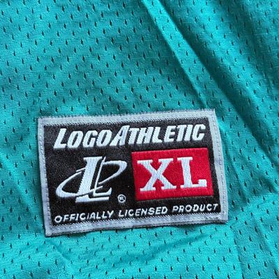 LOT 216A: NFL Team Merch: Green Bay Packers (Shirts, Jersey, Sweatpants), Miami Dolphins (Bedazzled Tee, Dan Marino Starter T, Jersey),...