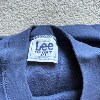 LOT 216A: NFL Team Merch: Green Bay Packers (Shirts, Jersey, Sweatpants), Miami Dolphins (Bedazzled Tee, Dan Marino Starter T, Jersey),...