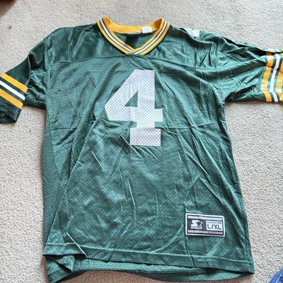 LOT 216A: NFL Team Merch: Green Bay Packers (Shirts, Jersey, Sweatpants), Miami Dolphins (Bedazzled Tee, Dan Marino Starter T, Jersey),...