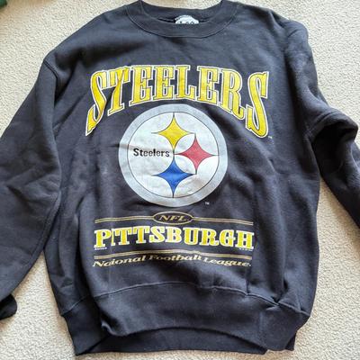 LOT 216A: NFL Team Merch: Green Bay Packers (Shirts, Jersey, Sweatpants), Miami Dolphins (Bedazzled Tee, Dan Marino Starter T, Jersey),...