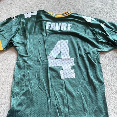 LOT 216A: NFL Team Merch: Green Bay Packers (Shirts, Jersey, Sweatpants), Miami Dolphins (Bedazzled Tee, Dan Marino Starter T, Jersey),...