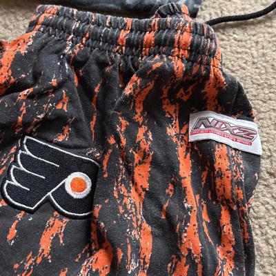 LOT 228L: NHL Philadelphia Flyers Clothing: PJ Pants, Sweat Suit, Polo, Muscle Tees, NWT & More