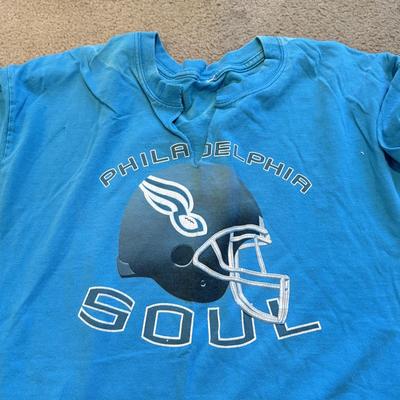 LOT 263B: Philadelphia Soul Football Fandom Collection: Shirts, Banner, Teddy & 2000s Cheerleader Signed Program