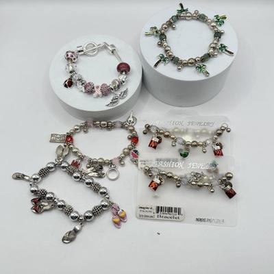 LOT 281J: Collection of Charm Bracelets