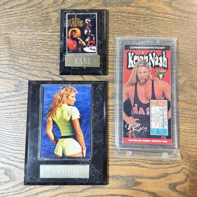 LOT 284J: Wrestling Memorabilia: Kevin Nash WCW Commemorative Ticket (750/10,000) w/ Sable & Kane Plaques