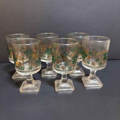 LOT 204: Brass Kiddush Cup Holder & Glass Set made in Isreal, Set of 6 Footed Glasses along with Blue Stem, Swirl Optic Glassware