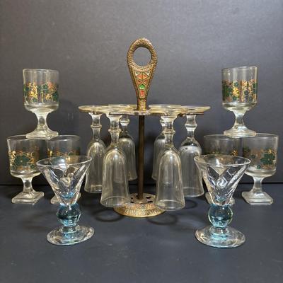 LOT 204: Brass Kiddush Cup Holder & Glass Set made in Isreal, Set of 6 Footed Glasses along with Blue Stem, Swirl Optic Glassware
