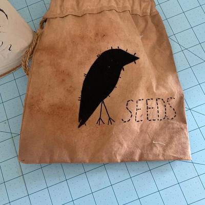Metal planter and seed bag