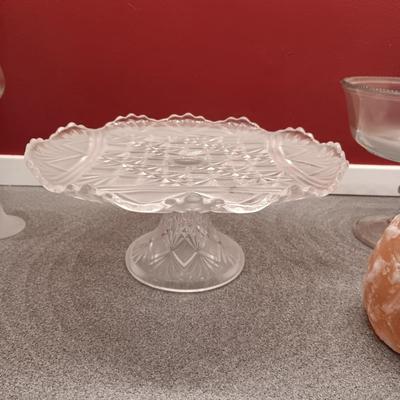 GLASS CAKE PLATE, TEA CUP AND SAUCER, CANDLE HOLDERS AND GLASS PAPER WEIGHT