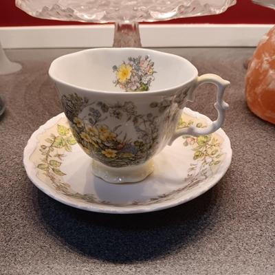 GLASS CAKE PLATE, TEA CUP AND SAUCER, CANDLE HOLDERS AND GLASS PAPER WEIGHT