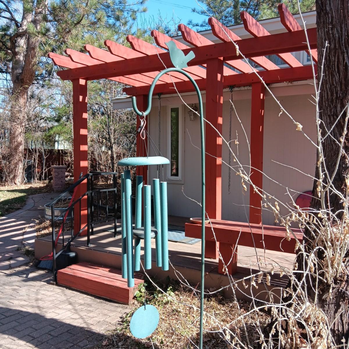 PLEASANT SOUNDING WINDCHIME WITH BIRD PERCHED SHEPHERDS HOOK
