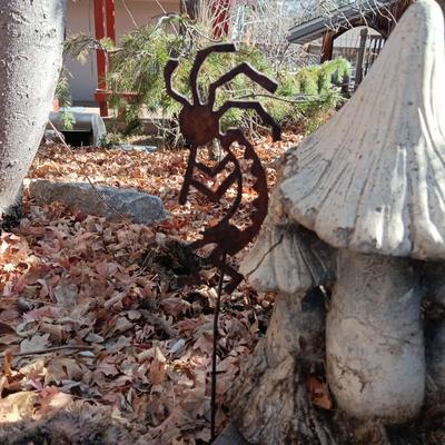 CONCRETE MUSHROOMS BY HENRI STUDIOS, OWL MADE OUT OF A ROCK AND STAKED METAL KOKOPELLI