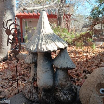 CONCRETE MUSHROOMS BY HENRI STUDIOS, OWL MADE OUT OF A ROCK AND STAKED METAL KOKOPELLI
