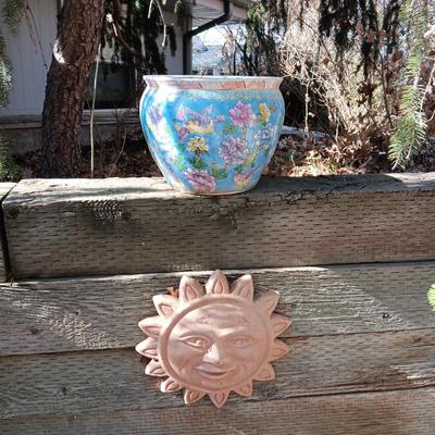 TERRACOTTA SUN AND A FLOWER POT