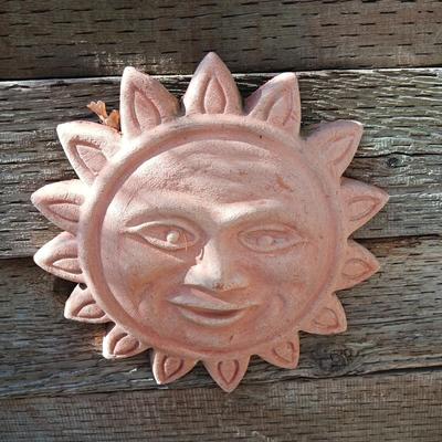 TERRACOTTA SUN AND A FLOWER POT