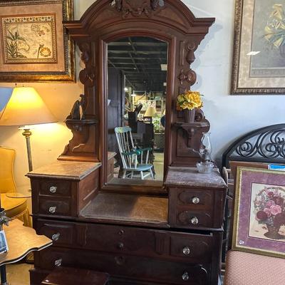 Renaissance antique walnut step down dresser with stone top