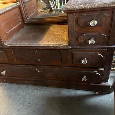 Renaissance antique walnut step down dresser with stone top