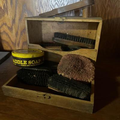 Vintage shoe shine box and brushes
