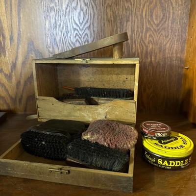 Vintage shoe shine box and brushes