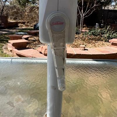GLASS TOP PATIO TABLE AND AN UMBRELLA