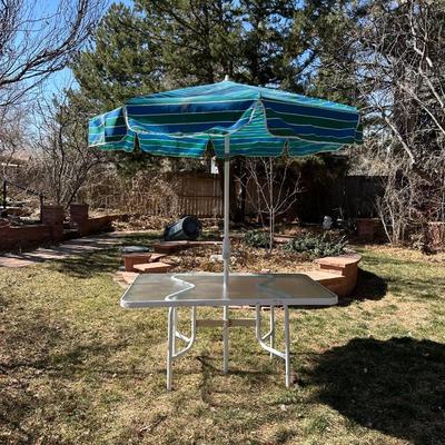 GLASS TOP PATIO TABLE AND AN UMBRELLA