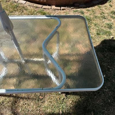 GLASS TOP PATIO TABLE AND AN UMBRELLA