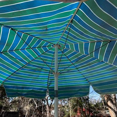 GLASS TOP PATIO TABLE AND AN UMBRELLA