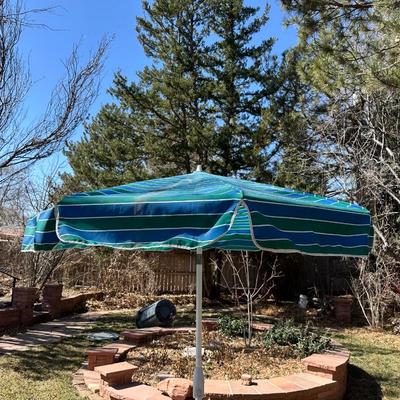 GLASS TOP PATIO TABLE AND AN UMBRELLA