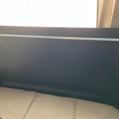 Full mattress and black headboard