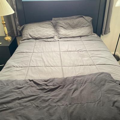 Full mattress and black headboard