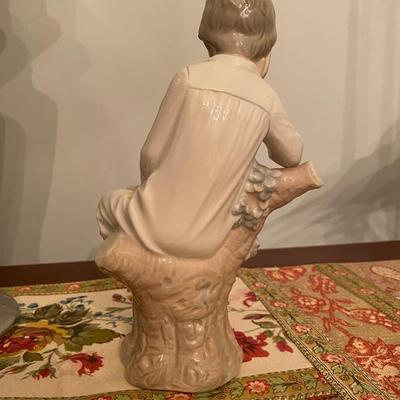 Porcelain Lladro boy sitting on a stump #4876