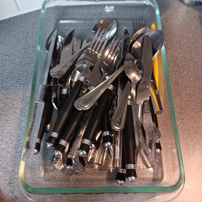 ASSORTED FLATWARE, GLASS SERVING BOWL AND BAKING DISH, CAST IRON NAPKIN HOLDER