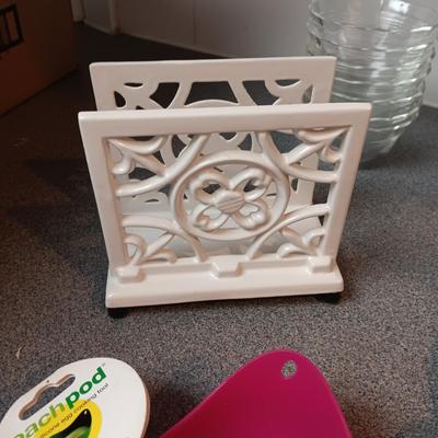 ASSORTED FLATWARE, GLASS SERVING BOWL AND BAKING DISH, CAST IRON NAPKIN HOLDER