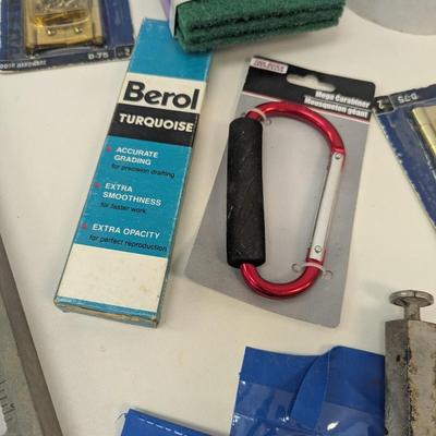 Assortment Of Hardware Supplies Squares Caulk Gun
