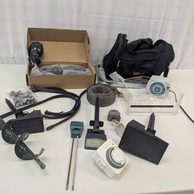 Assortment Of Yard Tools Sofa Legs Timers