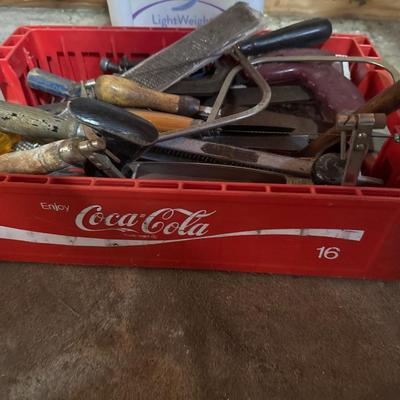Vintage Coca-Cola crate with tools in it