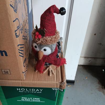 PRE-LIT TREE ON TOP OF RED TRUCK, WREATHS, FAUX FLOWERS AND SMALL PLUSH ANIMALS