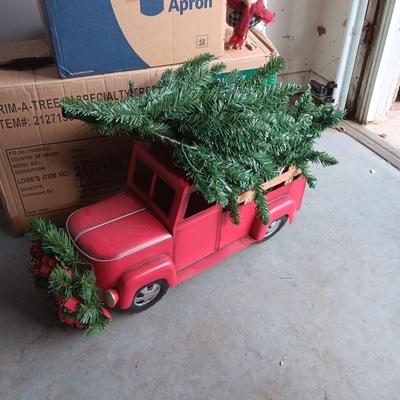 PRE-LIT TREE ON TOP OF RED TRUCK, WREATHS, FAUX FLOWERS AND SMALL PLUSH ANIMALS