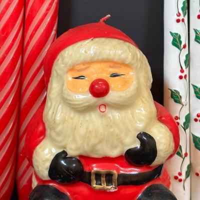LOT 290: Holiday Candle Collection & More: Santa & Snowman Tapered Candles,Gift Bag Music Boxes, Gold Bead Garland, Peppermint...