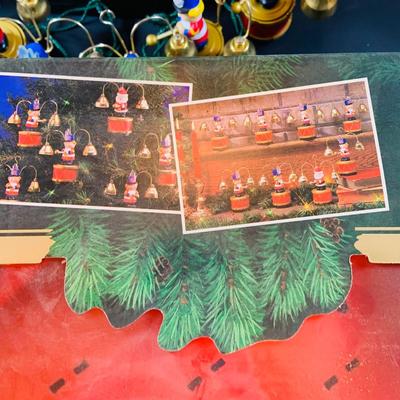 LOT 309: Mr Christmas' Santa's Marching Band with 16 Brass Bells and Plays 35 Christmas Carols in Working Condition with Box