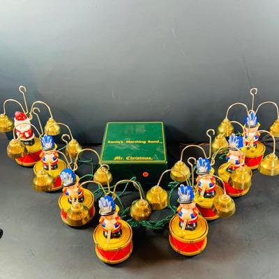 LOT 309: Mr Christmas' Santa's Marching Band with 16 Brass Bells and Plays 35 Christmas Carols in Working Condition with Box
