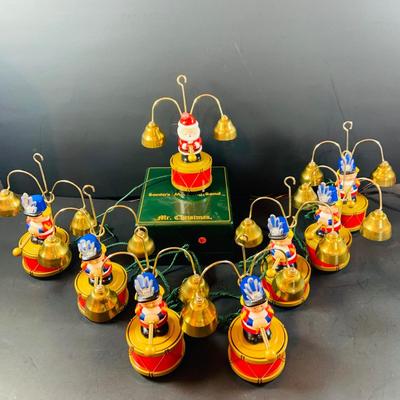 LOT 309: Mr Christmas' Santa's Marching Band with 16 Brass Bells and Plays 35 Christmas Carols in Working Condition with Box