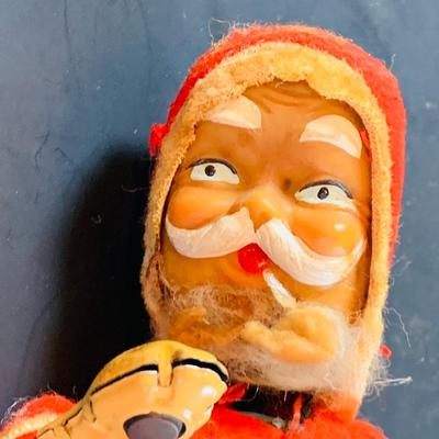 LOT 311: Vintage Mechanical Wind-up Toy Santas