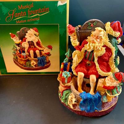 LOT 312: Collection of Holiday Home Decorations Including a Clock, Snow Globe and Fountian - All with Original Boxes